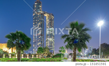 Skyscrapers of Abu Dhabi illuminated with Nation towers buildings day to night transition timelapse. Skyscrapers of Abu Dhabi illuminated with Nation towers buildings day to night transition timelapse. 131851591
