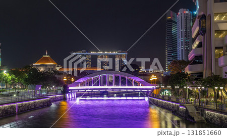 Skyline of Singapore financial district behind Elgin Bridge and the Singapore River night timelapse hyperlapse Skyline of Singapore financial district behind Elgin Bridge and the Singapore River night timelapse hyperlapse 131851660