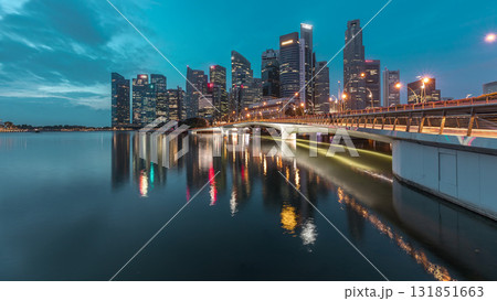 Esplanade bridge and downtown core skyscrapers in the background Singapore night to day timelapse 131851663