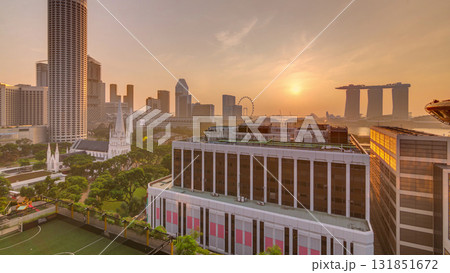 Sunrise over Singapore skyline with St. Andrew's Cathedral aerial night timelapse. Sunrise over Singapore skyline with St. Andrew's Cathedral aerial night timelapse. 131851672