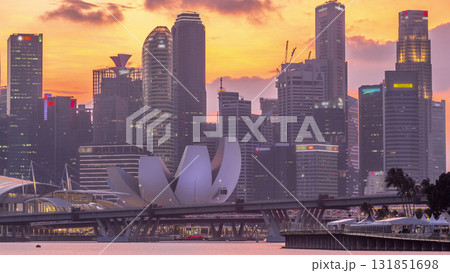 Downtown skyline of Singapore as viewed from across the water from The Garden East day to night timelapse. Singapore. Downtown skyline of Singapore as viewed from across the water from The Garden East day to night timelapse. Singapore. 131851698
