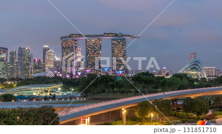 Aerial view after sunset with Singapore city skyline view from Marina barrage garden day to night timelapse. Aerial view after sunset with Singapore city skyline view from Marina barrage garden day to night timelapse. 131851710