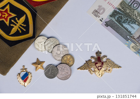 Russian Soviet military cap with service patches with ruby stars and hammer and sickle emblems. Medal with double headed eagle and red coat of arms. High quality photo Russian Soviet military cap with service patches with ruby stars and hammer and sickle emblems. Medal with double headed eagle and red coat of arms. High quality photo 131851744
