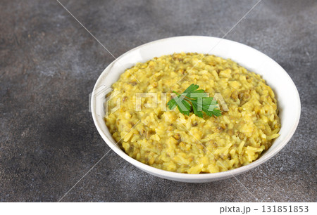 Indian khichri, kichri with rice, lentils and spices on grey background. Top view. Ayurvedic diet. 131851853