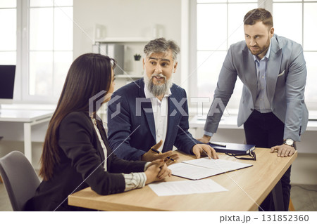 Corporate business people having a meeting in office, discussing new project or signing a contract 131852360