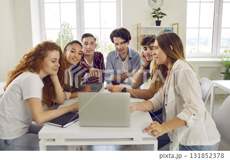 Group of college or university students working on digital presentation and using laptop 131852378