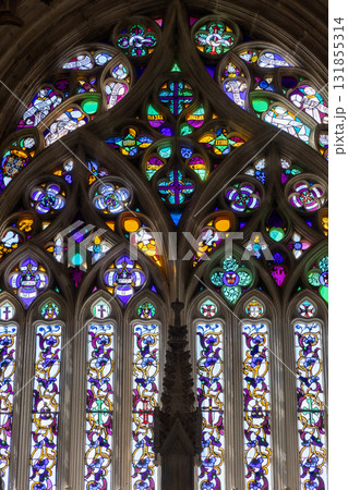 Vibrant Gothic Stained Glass Window with Intricate Floral Patterns Vibrant Gothic Stained Glass Window with Intricate Floral Patterns 131855314