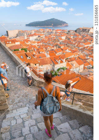 Woman exploring Dubrovnik Old Town enjoying city view and Adriatic Sea Woman exploring Dubrovnik Old Town enjoying city view and Adriatic Sea 131856665