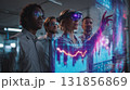 diverse group of four professionals wearing augmented reality glasses interact with digital data in modern office environment, showcasing innovation and teamwork 131856869