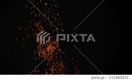 sparks and embers from campfire flying over black background 131860031