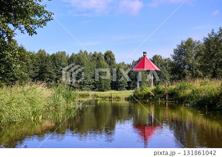 Tranquil Waterfront Gazebo on Sunny Day Tranquil Waterfront Gazebo on Sunny Day 131861042