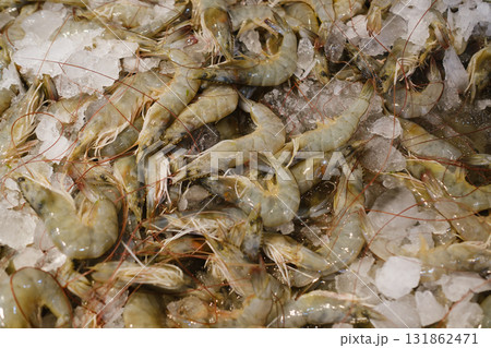 Fresh shrimp displayed on ice at a local market early in the morning, highlighting the day s catch from nearby waters Fresh shrimp displayed on ice at a local market early in the morning, highlighting the day s catch from nearby waters 131862471