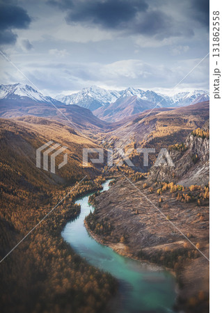 Mountain landscape panoramas of Altai . Mountain river and snow-capped peaks, beautiful view of the majestic nature of the Altai mountains. Panoramic view of the emerald river in the mountains. Mountain landscape panoramas of Altai . Mountain river and snow-capped peaks, beautiful view of the majestic nature of the Altai mountains. Panoramic view of the emerald river in the mountains. 131862558