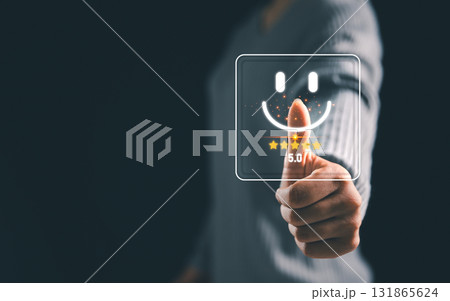 Business person touching virtual smiley face with five star rating, concept of positive customer feedback online review, satisfaction score, user experience and digital marketing service. satisfaction 131865624
