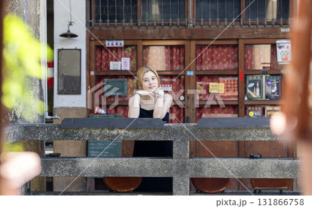 asian woman visit the chinese style temple with the hanging lanterns background in taiwan asian woman visit the chinese style temple with the hanging lanterns background in taiwan 131866758
