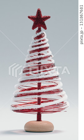 Red wire Christmas tree with snow and star decoration on wooden stand 131867681