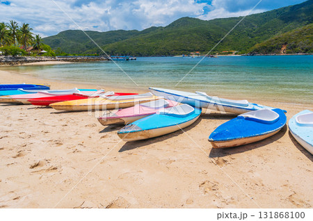 Kayaks on sandy beach by the sea in lagoon in summer on vacation on a sunny day 131868100