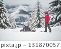 Two snowboarders before a ride Two snowboarders before a ride 131870057