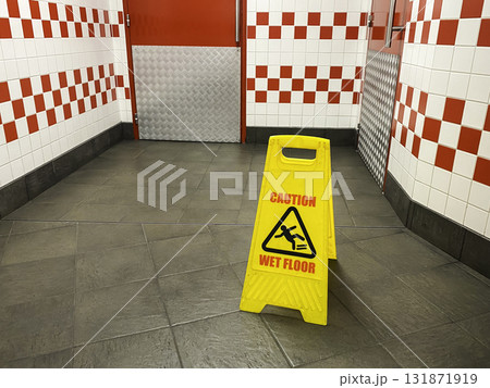 warning sign on the floor in restaurant 131871919