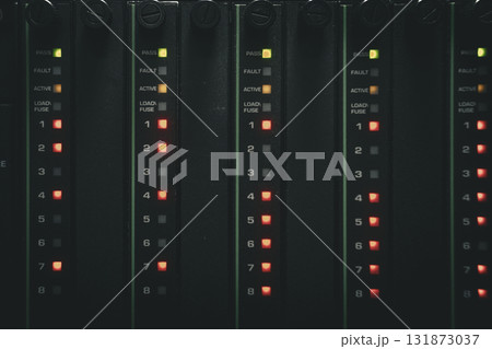 Row of led lamps with a green light on the top left 131873037