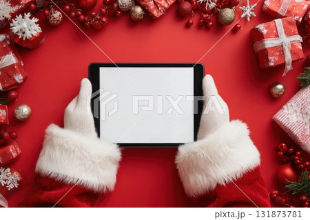 Santa Holding Ebook Gadget Isolated Bright Vivid Vibrant Red Maroon Color Background. Santa Claus Gloved Hand Presenting White Digital Tablet Blank Screen MockUp. Christmas Gifts Buying. Empty border Santa Holding Ebook Gadget Isolated Bright Vivid Vibrant Red Maroon Color Background. Santa Claus Gloved Hand Presenting White Digital Tablet Blank Screen MockUp. Christmas Gifts Buying. Empty border 131873781