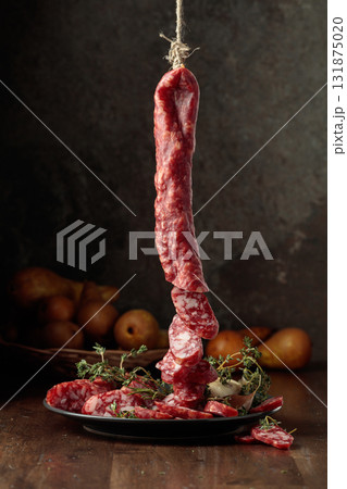 Dry-cured sausages with thyme and pears. Dry-cured sausages with thyme and pears. 131875020