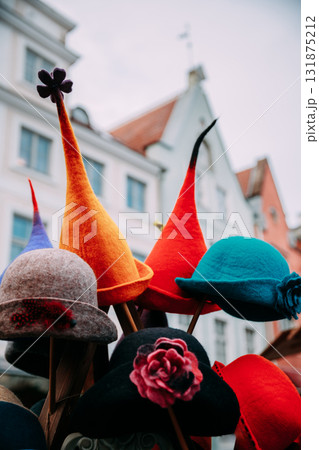 Tallinn, Estonia, Europe. Traditional Christmas Winter Market With Warm Hats. Colorful Traditional European Warm Clothes. Xmas Souvenir From Europe. Tallinn, Estonia, Europe. Traditional Christmas Winter Market With Warm Hats. Colorful Traditional European Warm Clothes. Xmas Souvenir From Europe. 131875212