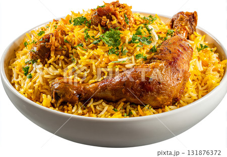 A close-up of delicious Chicken Biryani in a bowl, featuring spiced chicken pieces, basmati rice, saffron color, onions, and cilantro. 131876372
