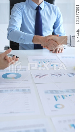 Business handshake agreement in modern office with financial documents, successful partnership deal, teamwork collaboration and corporate negotiation concept Business handshake agreement in modern office with financial documents, successful partnership deal, teamwork collaboration and corporate negotiation concept 131877091