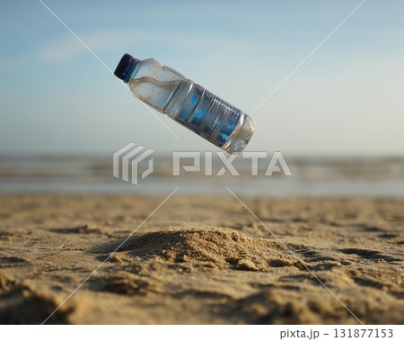 Clear plastic water bottle floating above sandy beach with small sand mound and blurred sea horizon, natural light and subtle motion Clear plastic water bottle floating above sandy beach with small sand mound and blurred sea horizon, natural light and subtle motion 131877153