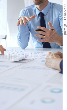 Corporate team of business professionals reviewing financial charts and graphs during meeting, analyzing data strategy, discussing growth performance, and planning market goals. Businesspeople at work Corporate team of business professionals reviewing financial charts and graphs during meeting, analyzing data strategy, discussing growth performance, and planning market goals. Businesspeople at work 131877457