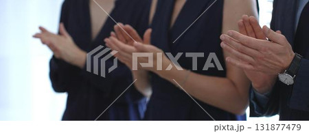 Business people hands clapping, showing applause and appreciation for success and achievement during a corporate event or conference meeting in office Business people hands clapping, showing applause and appreciation for success and achievement during a corporate event or conference meeting in office 131877479