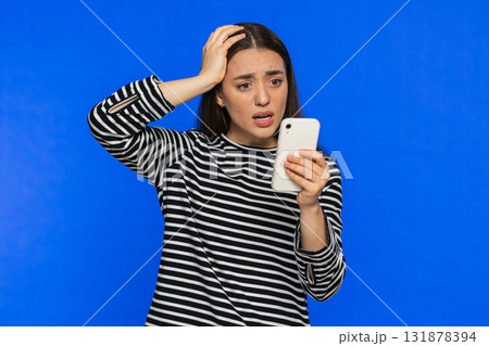 Upset sad woman use smartphone play game, loses, loss fail unlucky news, bad lottery results, crisis 131878394