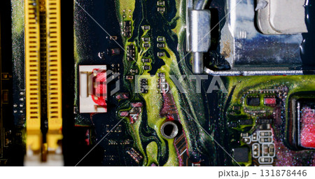 Acrylic ink. Circuit board. Blur yellow purple red colorful glitter liquid microchip dark black water on abstract electronic background. 131878446