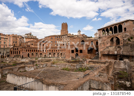 Ancient brick ruins of Trajan Market in Rome under cloudy blue sky 131878540