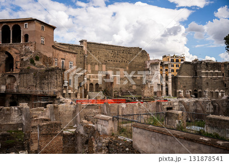 Ancient stone ruins and old buildings in historic center of Rome under cloudy sky 131878541