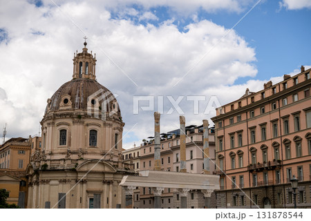 Historic dome church and ancient columns with classic architecture under cloudy sky in Rome 131878544