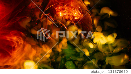 Underwater smoke. Blur light glow. Illuminated garland glass abstract color splash. Red yellow green cloud ink flow on dark sparkling background. 131878650