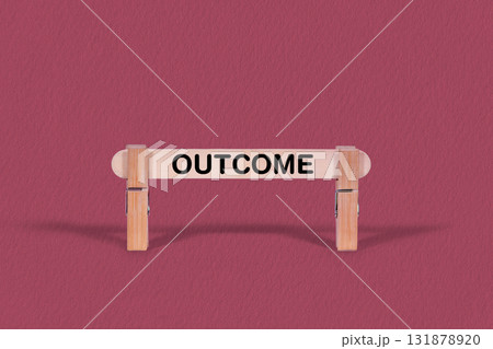 Outcome symbol. Single Wooden stick pinned by Clothespins, beautiful Pink Background. Business and Outcome concept with copy space Outcome symbol. Single Wooden stick pinned by Clothespins, beautiful Pink Background. Business and Outcome concept with copy space 131878920