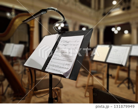 Music score with notes in hall of the conservatory at classical music concert 131879949