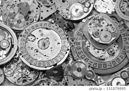 Old mechanical watches with gears and cogs. Watch or clock mechanisms Old mechanical watches with gears and cogs. Watch or clock mechanisms 131879995