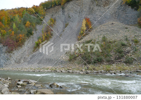 Beautiful mountain river with rapid current. Prut river and mountain folds Beautiful mountain river with rapid current. Prut river and mountain folds 131880007