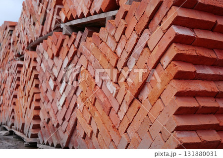 Stacks of red bricks in construction supermarket 131880031