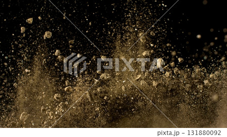 Freeze Motion Shot of Flying Soil , Isolated on Black Background Freeze Motion Shot of Flying Soil , Isolated on Black Background 131880092