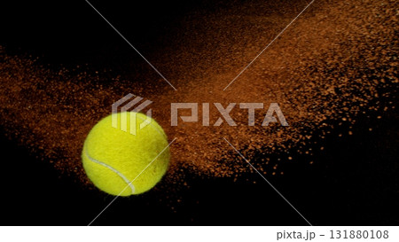 Freeze Motion Shot of Flying Tennis Ball with Clay , Isolated on Black Background Freeze Motion Shot of Flying Tennis Ball with Clay , Isolated on Black Background 131880108