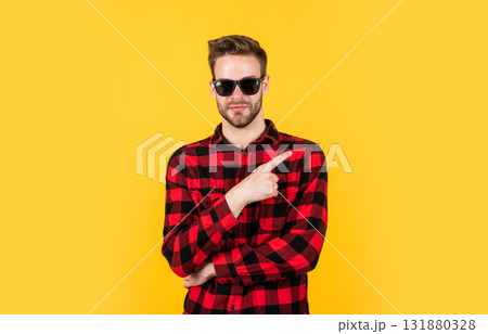 pointing finger. barbershop concept. mens wear. young handsome guy in checkered shirt and glasses. stylish male wear casual clothes. bearded man with bristle on unshaven face. fashion and beauty 131880328