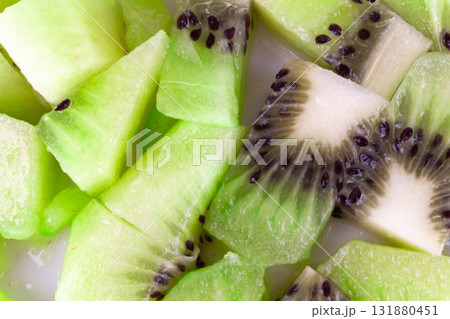 Diced kiwi fruit cubes with texture background 131880451