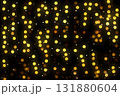 Golden bokeh lights glow in dark background, creating warm festive ambiance and dreamy atmosphere tonight 131880604