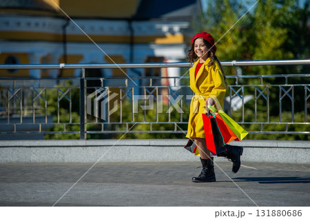 teen girl walk with shopping bag. autumn shopping. teen girl hold shopping bag in autumn. autumn sale and discount. teen girl in the city. copy space. indulging in shopping 131880686