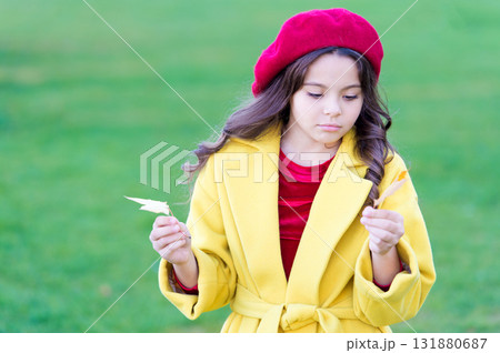 Autumn coziness is just around. Little girl sad coming about autumn season. Tips for turning autumn into best season. Kid girl sad face hold maple leaves. Child with autumn maple leaves walk Autumn coziness is just around. Little girl sad coming about autumn season. Tips for turning autumn into best season. Kid girl sad face hold maple leaves. Child with autumn maple leaves walk 131880687